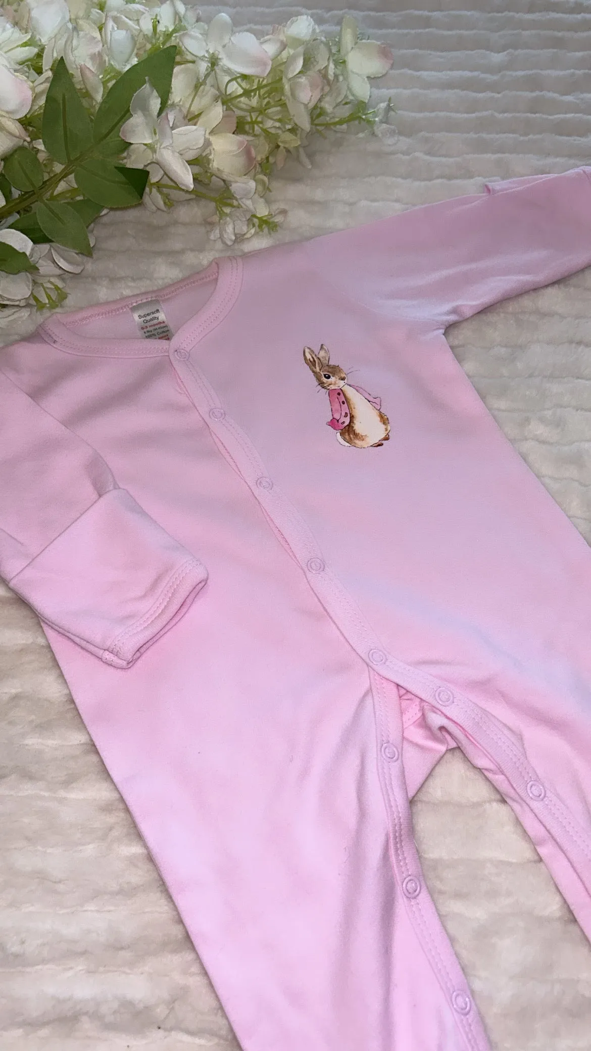 Pink romper Peter rabbit design